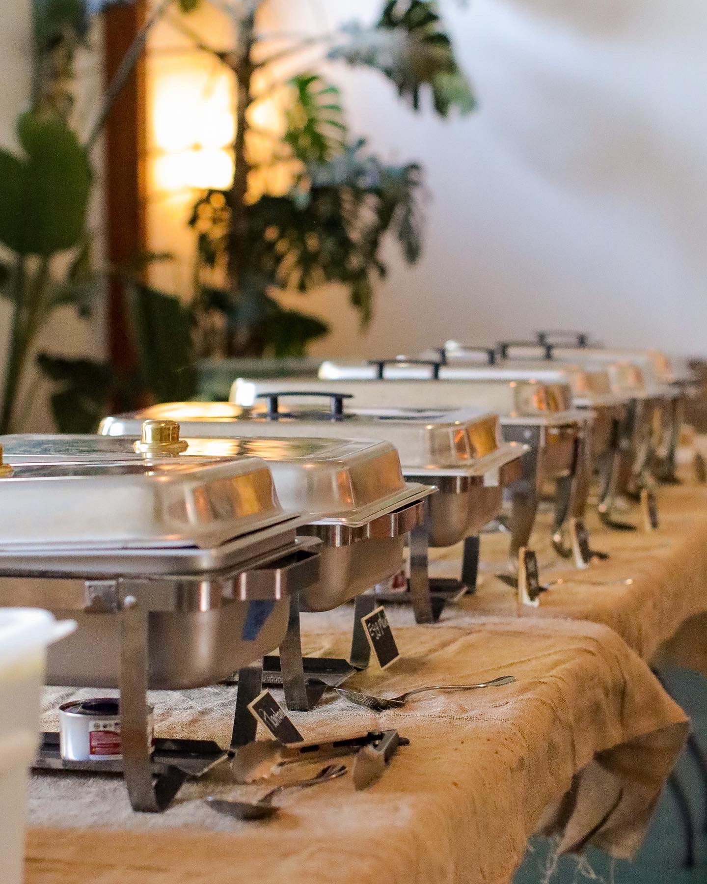 A row of chafing dishes for a catered event